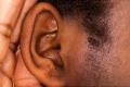Wireless hearing aids adjusted over the phone