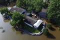 Dams against flooding help men feel safe when the whole town is in the sea
