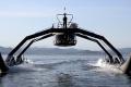 Iron spiders carry people on the water
