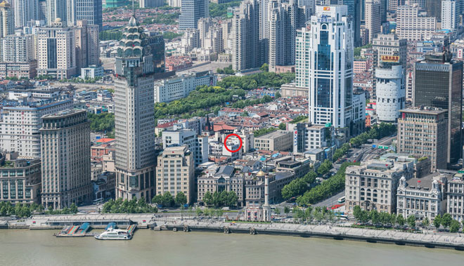 Picture 3 of A picture of the whole city of Shanghai, zoomed to the pedestrian's face