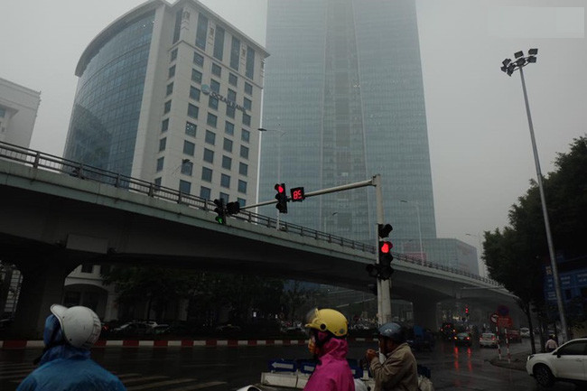Picture 1 of Beams: Near noon, Hanoi fades in a dense fog