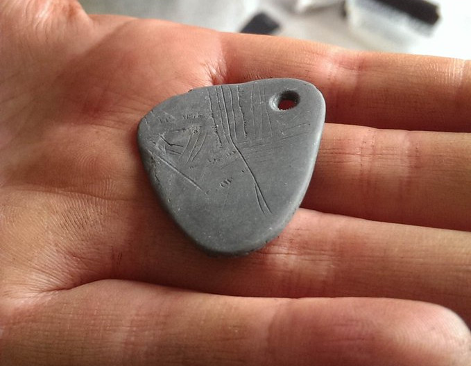 Picture 1 of Decode the secret code on the 11,000-year-old pendant