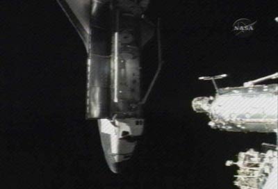 Picture 2 of Discovery into the International Space Station