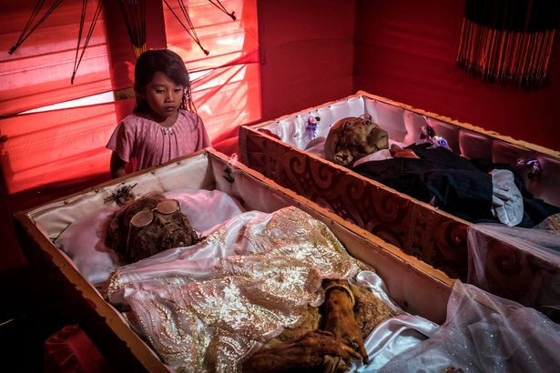 Picture 5 of Inside the 'village of death', where the villagers dig graves, wear new clothes for the body