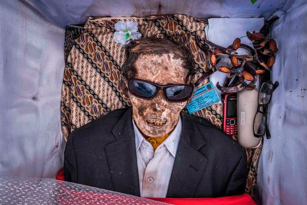 Picture 6 of Inside the 'village of death', where the villagers dig graves, wear new clothes for the body