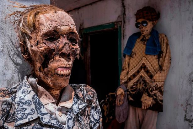 Picture 8 of Inside the 'village of death', where the villagers dig graves, wear new clothes for the body
