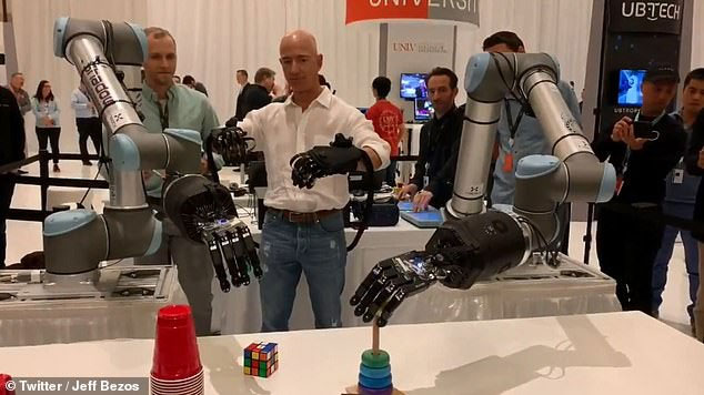 Picture 1 of Jeff Bezos 'shows off' robotic arms delicate enough to play rubik