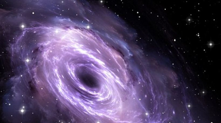 Picture 1 of Monster black holes are 100,000 times bigger than the Sun.