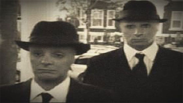 Mysterious people dressed in black protect the aliens images 4