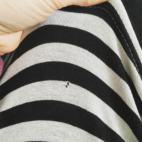 Picture 3 of Mysteriously annoying holes on T-shirts - why do you wear them for a few times?