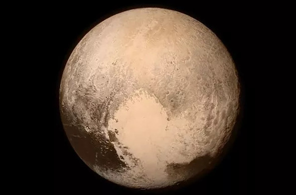 Picture 3 of Pluto has 'blue sky' and ice water