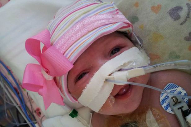 She was born with a heart outside her body images 1