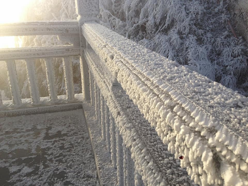 Picture 2 of Snow ice covered white Fansipan peak and Hoang Lien forest