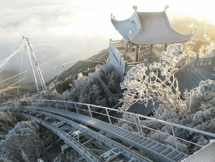 Picture 4 of Snow ice covered white Fansipan peak and Hoang Lien forest