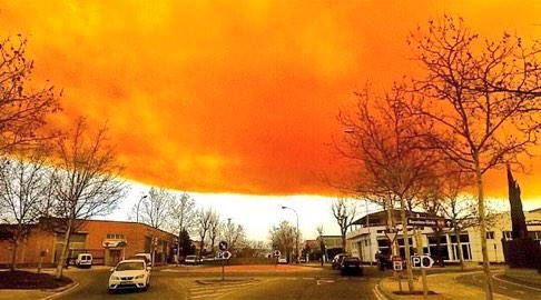 Picture 1 of Spain: Orange clouds cover the sky