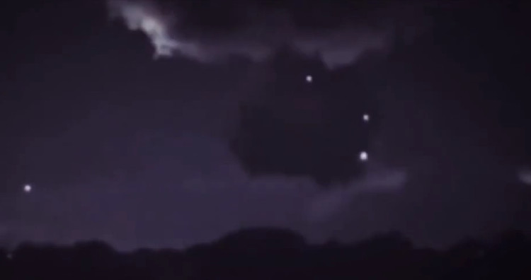 Picture 1 of Spotlight next to a cloud of suspicious UFOs collecting storm energy