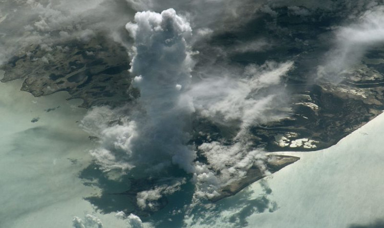 Picture 1 of Stands of clouds stand like watchtowers from the universe