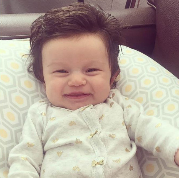 Picture 2 of Strange new born baby girl has super beautiful short hair