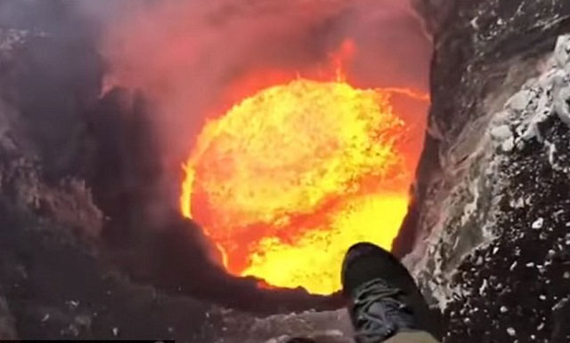 Picture 1 of Stun with the pilot hovering over the spraying crater