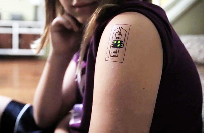 Picture 1 of Tattoos electrical circuits on the skin to form sensors that monitor temperature and blood pressure