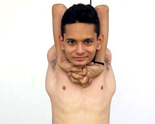 Picture 2 of The Indian boy has a flexible body like rubber, 360 degrees of his shoulders and a 180-degree neck
