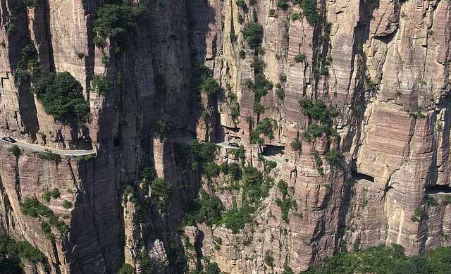 Picture 4 of The tunnel runs through 1,700 m high cliffs, dug by hand for 5 years