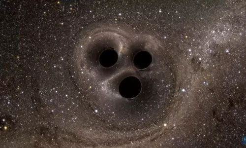 Picture 1 of Three black holes revolve around each other before the clash