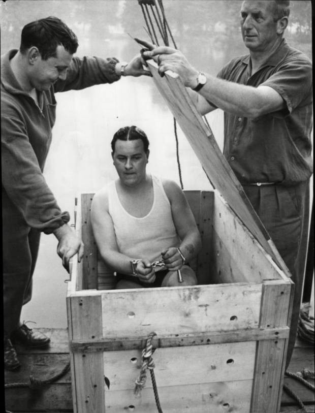Picture 4 of Topple the classic magic trick: handcuffed in a sealed container
