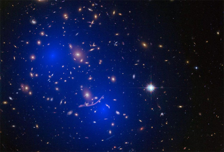 Picture 1 of Two clusters of galaxies contain hundreds of billions of stars about to collide