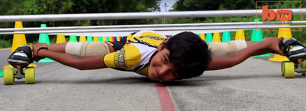 Picture 1 of Video: 8-year-old roller skates through 53 cars lined up together