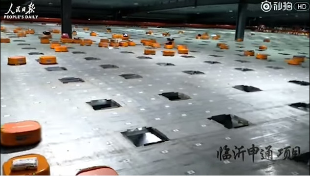 Picture 1 of Video: The army of robots lined up in Chinese warehouses