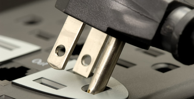 Picture 1 of Why do electrical plugs have to be designed with 3 legs for cumbersome?