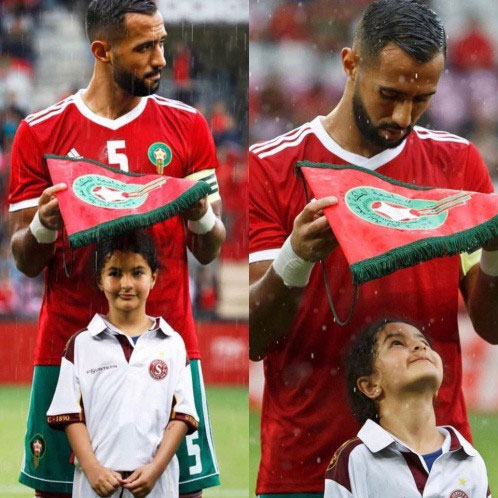 Picture 1 of Why do soccer players always walk out to the yard with children?