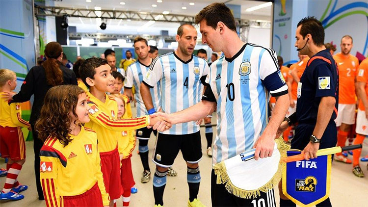 Picture 4 of Why do soccer players always walk out to the yard with children?