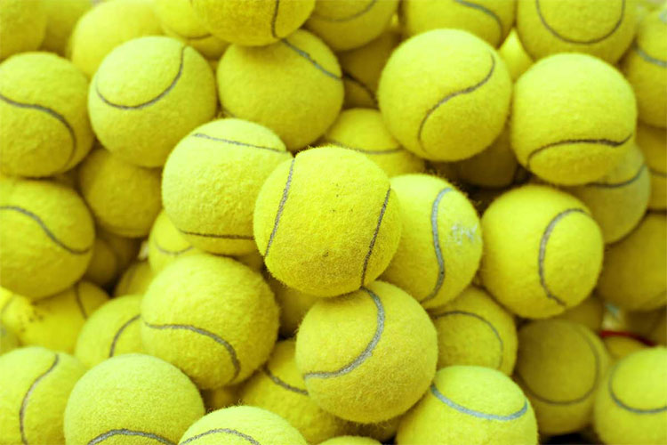 Picture 1 of Why do tennis balls have a ruffled green surface?