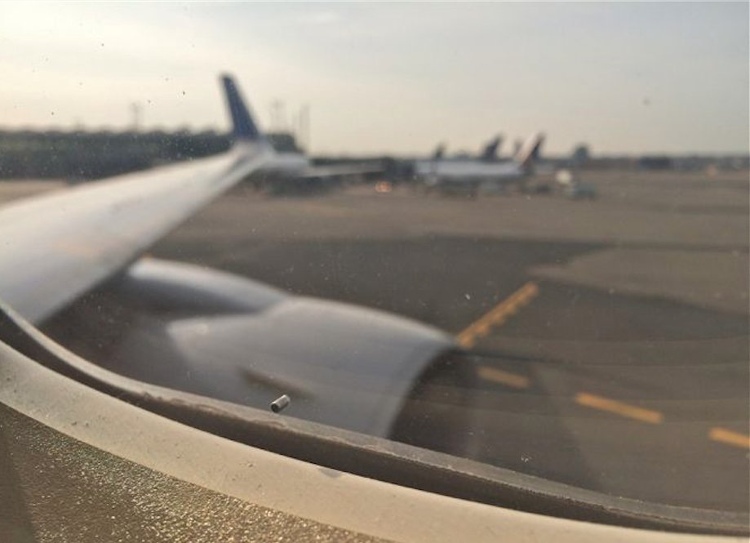 Picture 2 of Why does the plane window have a small hole?