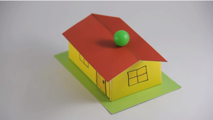 Picture 1 of Why does this ball not fall off the roof?