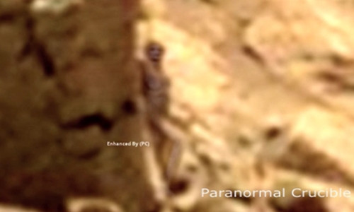 Picture 2 of 'Woman' hides behind a rock on Mars