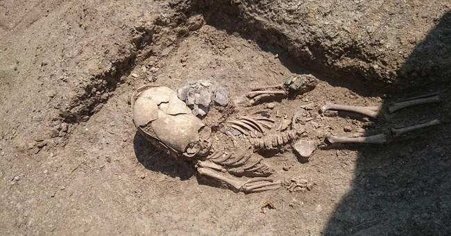 2,000-year-old remains of a boy with an