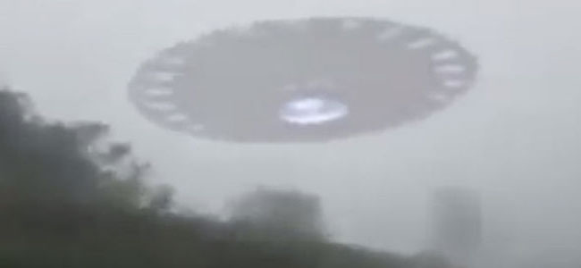 A close-up video of UFO flying over a car clearly visible