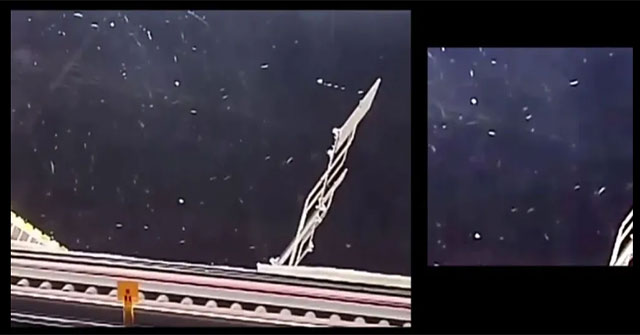 A mysterious object suddenly appears behind the astronaut on the ISS station