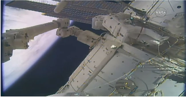 American astronauts walk outside the space to install high-resolution cameras