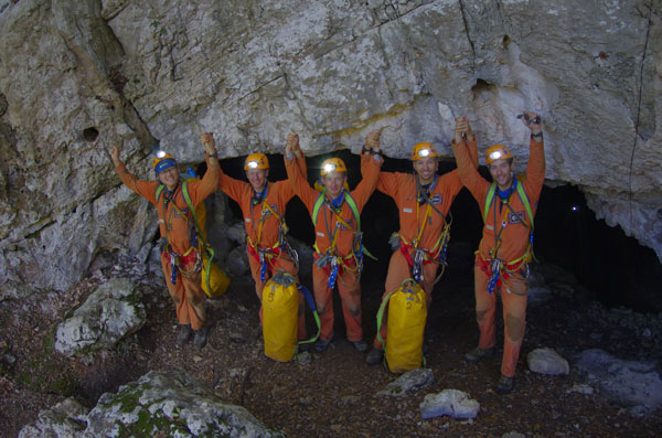 Astronauts crawl into the cave to train