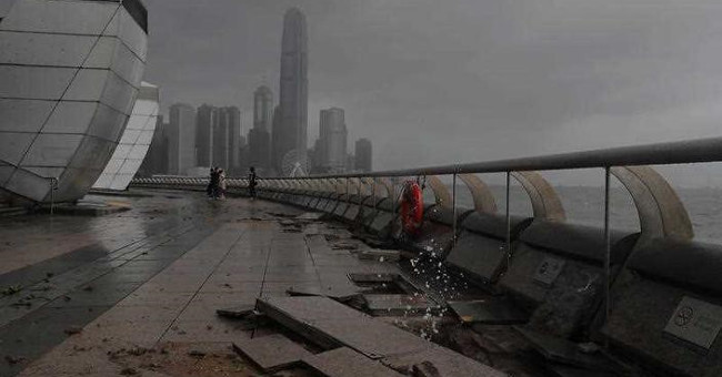 Broken pavement, sunken cars in super storm Hato in China
