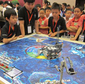 Children compete with robots in Hanoi