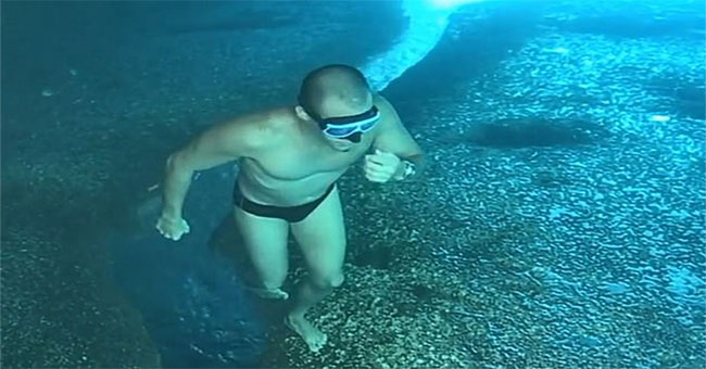 Clip on brain damage: Why do young people walking on the sea floor suddenly jump into the sea?
