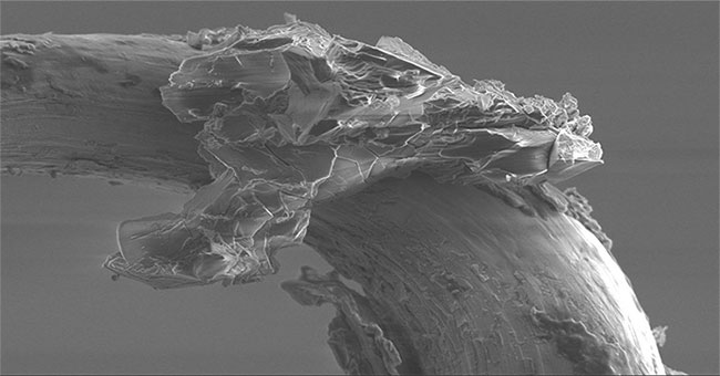 Close up of asteroid dust through a microscope, revealing many mysteries