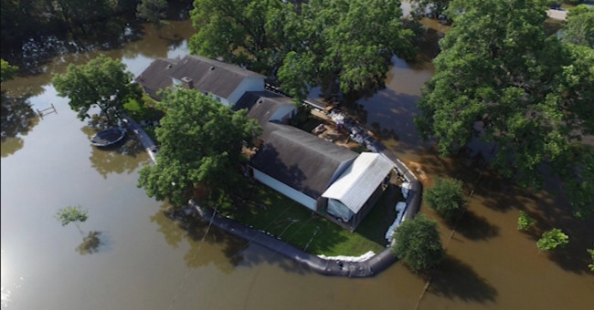 Dams against flooding help men feel safe when the whole town is in the sea