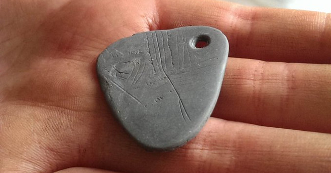 Decode the secret code on the 11,000-year-old pendant