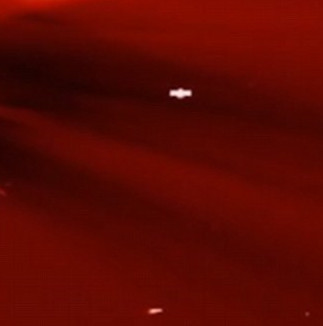 Detecting a strange UFO object flying across the Sun.